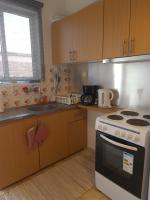 A kitchen or kitchenette at Seaside Apartment in Xilokastro - Thalassa Blue by Booking Kottas