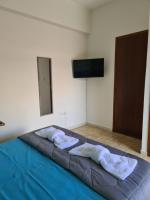 A television and/or entertainment centre at Seaside Apartment in Xilokastro - Thalassa Blue by Booking Kottas