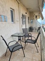 A balcony or terrace at Seaside Apartment in Xilokastro - Thalassa Blue by Booking Kottas