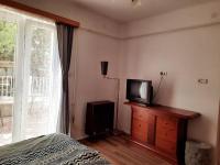 Televízia a/alebo spoločenská miestnosť v ubytovaní Central Room