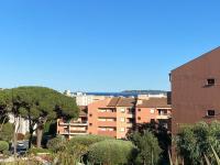 a view of a city with a tree and buildings at appartement vue mer avec place de parking privée in Sainte-Maxime