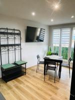 Televízia a/alebo spoločenská miestnosť v ubytovaní CASA LOUNA T2 Plage 400m