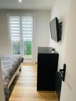 Televízia a/alebo spoločenská miestnosť v ubytovaní CASA LOUNA T2 Plage 400m