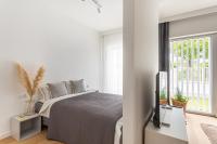Postel nebo postele na pokoji v ubytování S35 Apartments Gdynia Orłowo