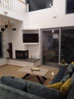 A television and/or entertainment centre at Loft House Zante