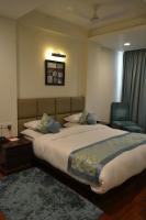 Ein Bett oder Betten in einem Zimmer der Unterkunft Sobti Continental Bareilly