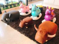 a group of toy animals on plates on a floor at Guanko Hotel in Chiayi City