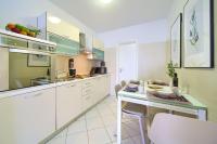 Kuchyň nebo kuchyňský kout v ubytování Apartments Aster