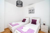 Posteľ alebo postele v izbe v ubytovaní Holiday Home King