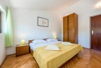 Postel nebo postele na pokoji v ubytování Apartments Žirje