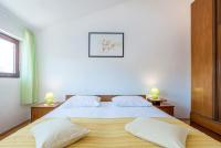 Postel nebo postele na pokoji v ubytování Apartments Žirje