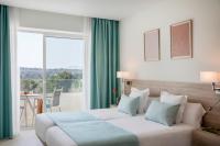 Łóżko lub łóżka w pokoju w obiekcie Aparthotel Marina Drach