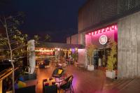a restaurant with purple lights on a patio at night at MaRadha Colombo in Colombo