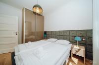 Posteľ alebo postele v izbe v ubytovaní Apartament Silence BORGUNO 06