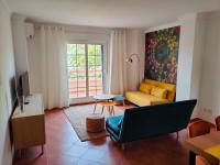 Televízia a/alebo spoločenská miestnosť v ubytovaní Golf, kitesurf, tennis, paddle, free bicycles - Apartment Andalusia