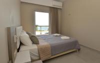 Posteľ alebo postele v izbe v ubytovaní Flisvos Rooms