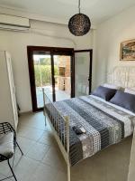 Posteľ alebo postele v izbe v ubytovaní Paralia Pefkohori apartments