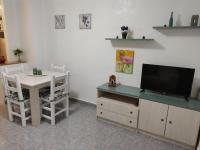Televízia a/alebo spoločenská miestnosť v ubytovaní Apartament Cristina