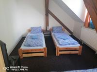 Postel nebo postele na pokoji v ubytování Penzion U Hladů