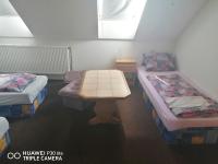 Postel nebo postele na pokoji v ubytování Penzion U Hladů