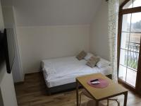 Posteľ alebo postele v izbe v ubytovaní Apartamenty, Zielone Wzgórze Wiktora w Mikołajkach