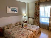 Posteľ alebo postele v izbe v ubytovaní Hotel BONCOMPTE