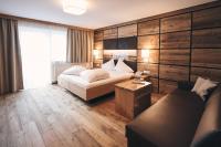 Łóżko lub łóżka w pokoju w obiekcie Hotel Gamsleiten