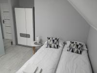Posteľ alebo postele v izbe v ubytovaní Apartamenty, Zielone Wzgórze Wiktora w Mikołajkach