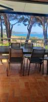 a table and chairs with a view of the ocean at I Casetti in Molini