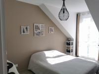 Ein Bett oder Betten in einem Zimmer der Unterkunft Chambre chez particulier proche circuit 24h