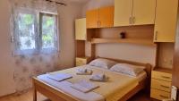 Postel nebo postele na pokoji v ubytování Apartments Gajo