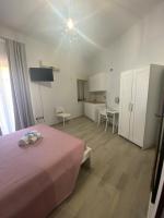 Łóżko lub łóżka w pokoju w obiekcie Home Demetra