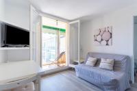 a living room with a couch and a large window at Cosy Apt Of 25 M Near The City View On Sea in La Seyne-sur-Mer