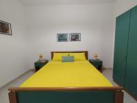A bed or beds in a room at Gallipoli Baia Blu Max