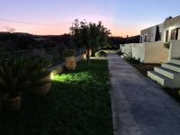 A garden outside Olivar Suites