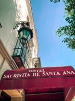 a hotel sign on the side of a building at Sacristia de Santa Ana in Seville