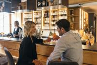 a man and a woman sitting at a bar at Feelfree Nature Resort in Oetz