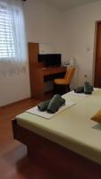Postel nebo postele na pokoji v ubytování Guest House Vukušić