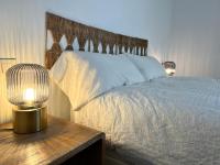 A bed or beds in a room at CocoBeach Mojácar