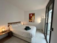 A bed or beds in a room at CocoBeach Mojácar