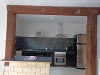 Kuchyňa alebo kuchynka v ubytovaní appartement avec balcon
