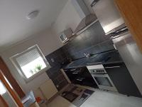 Kuchyňa alebo kuchynka v ubytovaní appartement avec balcon