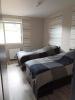 Posteľ alebo postele v izbe v ubytovaní appartement avec balcon