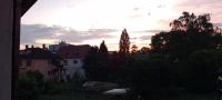 a sunset over a city with trees and houses at &quot;le Loft B BG &quot; appartement avec terrasse G Friendly in Strasbourg