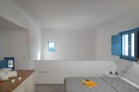 Postel nebo postele na pokoji v ubytování Camvillia Donoussa Village Suites