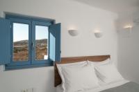 Postel nebo postele na pokoji v ubytování Camvillia Donoussa Village Suites