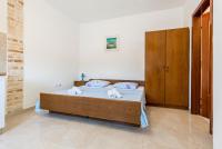 Postel nebo postele na pokoji v ubytování Apartments Žirje