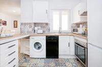 Kuchyň nebo kuchyňský kout v ubytování Marmoles 21, City Center Apartment