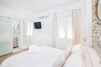Postel nebo postele na pokoji v ubytování Marmoles 21, City Center Apartment