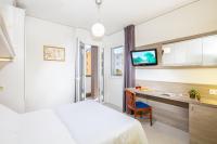 Posteľ alebo postele v izbe v ubytovaní Hotel Alexander